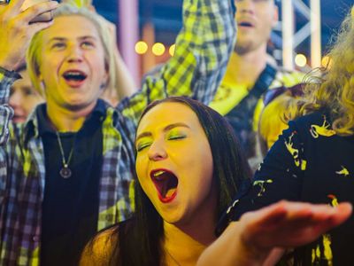 A blurred motion of a woman performing a stretch.