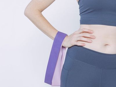 A woman’s hand adjusting a fitness band.