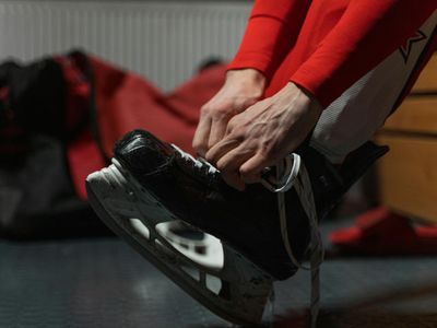 Close up of sports shoes in a dark training room.